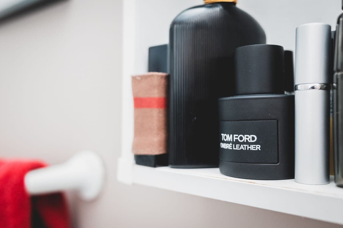 Plain men's toiletries lined up on a shelf